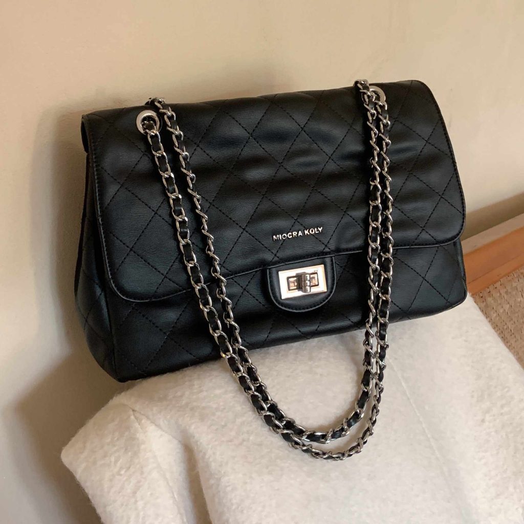 Lady's black leather crossbody bag
